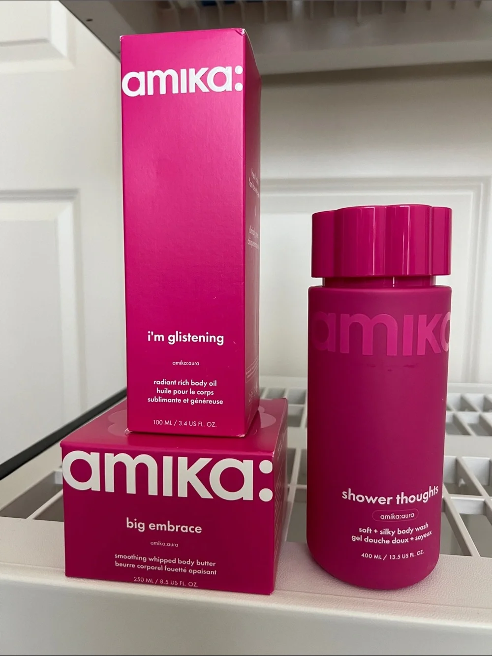 amika hot pink body wash & body oil set